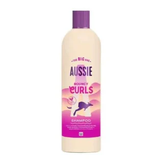 Champú Aussie Bouncy Curls 400 ml. Limpia e hidrata suavemente el cabello ondulado y rizado.