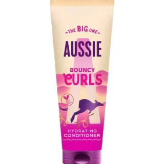 Acondicionador hidratante Aussie Bouncy Curls de 275 ml. Potencia la hidratación para cabello ondulado y rizado.